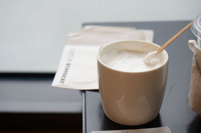 Close-up of coffee cup on table