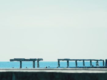 Close-up of railing against clear sky