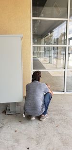 Rear view of woman sitting on seat