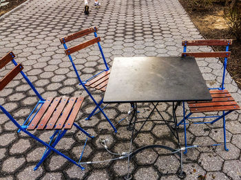 High angle view of empty chairs in park