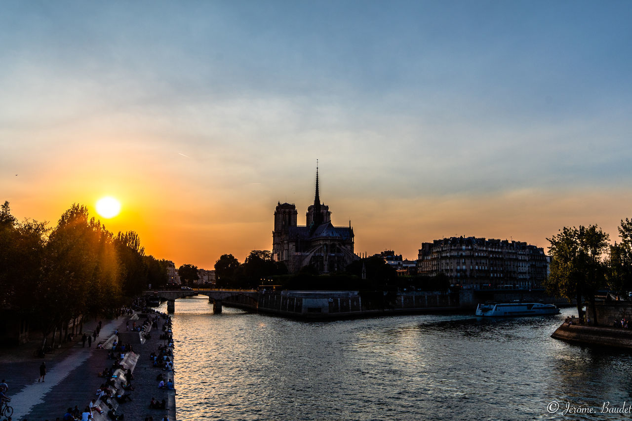 sky, architecture, building exterior, water, built structure, sunset, nautical vessel, cloud - sky, river, nature, transportation, waterfront, city, building, travel destinations, tree, travel, plant, no people, outdoors, government