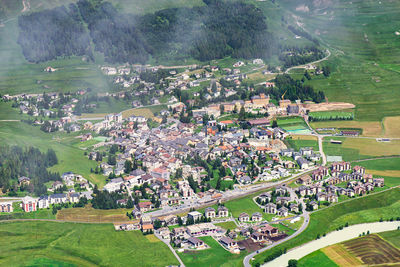 High angle view of townscape on field by buildings