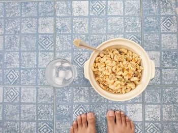 High angle view of man and breakfast on table