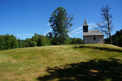 Built structure on field against clear sky