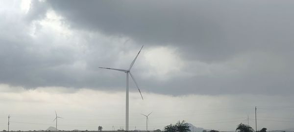 Low angle view of wind turbine against sky
