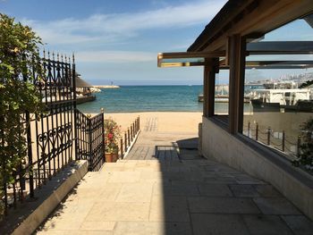 Scenic view of swimming pool by sea against sky