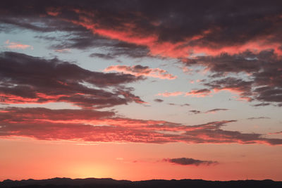 Low angle view of dramatic sky during sunset