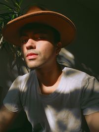 Portrait of young woman wearing hat