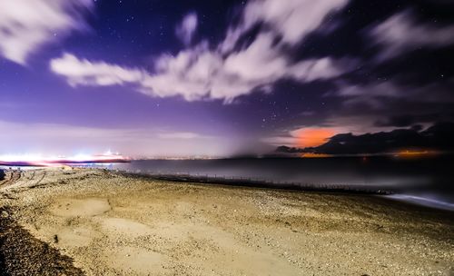 Scenic view of sea against sky at night