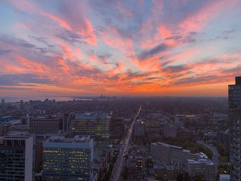 High angle view of buildings against sky during sunset