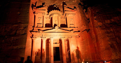 Low angle view of illuminated building at temple