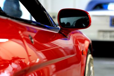 Close-up of red vintage car