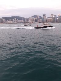 Scenic view of sea and buildings against sky