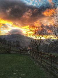 Scenic view of landscape against cloudy sky