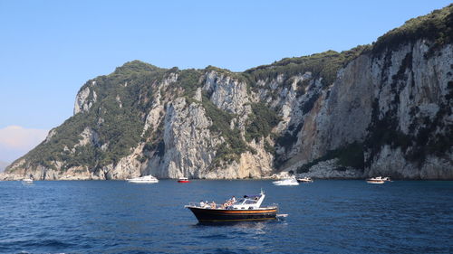 Sailboat on sea against clear sky