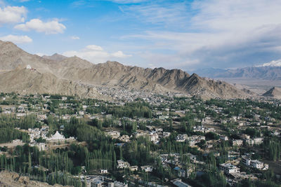 Scenic view of residential district against sky