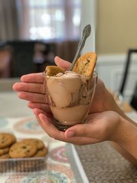 Close-up of hand holding ice cream
