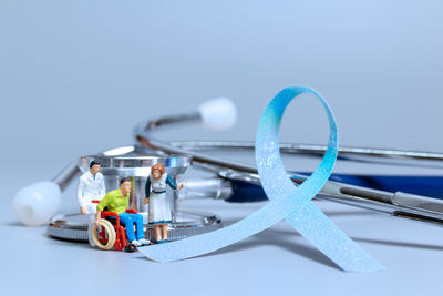 Close-up of machinery on table against blue background