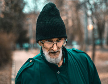 Portrait of old man wearing hat