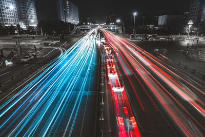 High angle view of light trails on road at night
