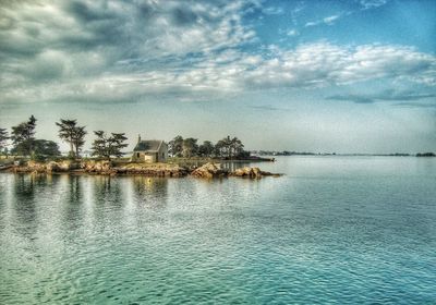 Scenic view of sea against cloudy sky