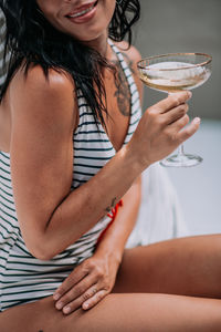 Midsection of woman holding ice cream