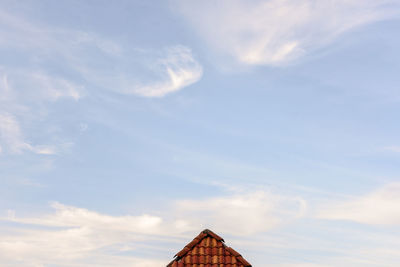 Low angle view of roof against sky