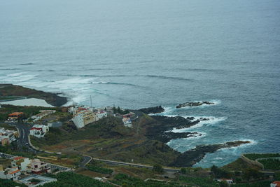 High angle view of sea and buildings