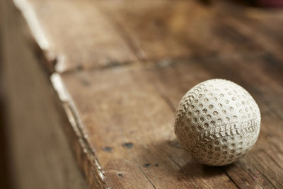 Close-up of ball on wooden table
