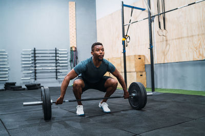 Male athlete exercising in gym