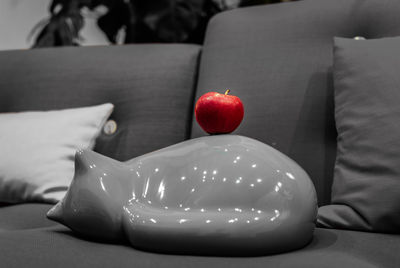 Close-up of apple on sofa