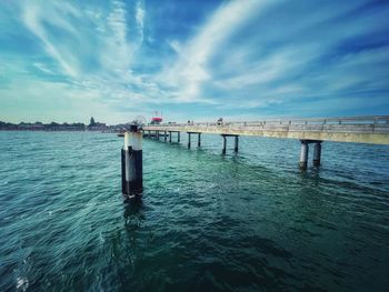 Pier over sea against sky