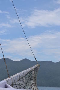 Low angle view of ski lift against sky