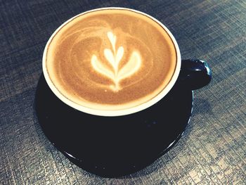 High angle view of cappuccino on table