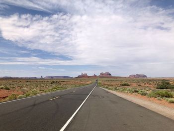 Empty road along countryside landscape, monument valley 
