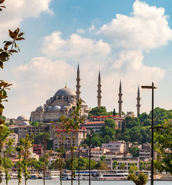 Buildings in city against sky