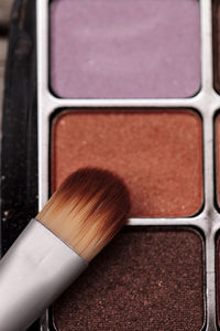 Close-up of beauty product with make-up brush