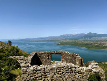 Scenic view of mountains against clear blue sky