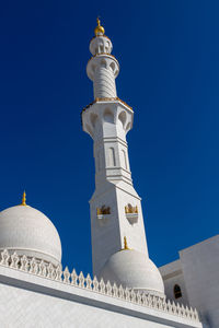 Low angle view of building against blue sky