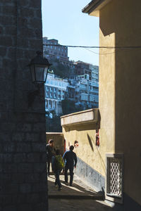 Rear view of people walking in building