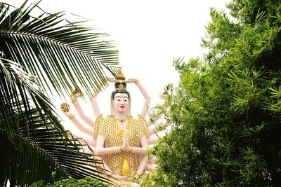 Low angle view of guanyin statue at wat plai laem temple