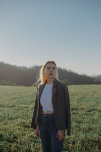 A young woman standing in a field