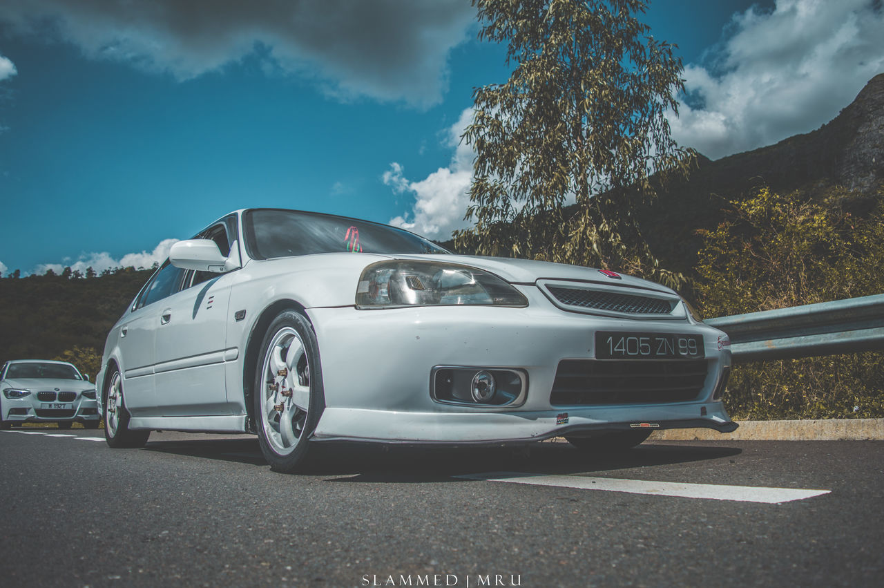 CARS PARKED ON ROADSIDE