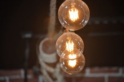 Close-up of illuminated light bulb