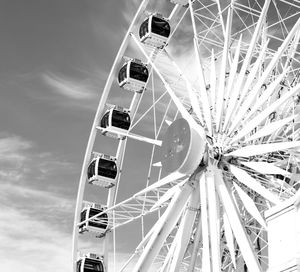 Low angle view of ferris wheel against sky