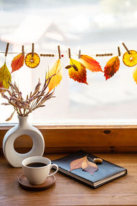 Autumn aesthetic still life on windowsill. fall home decorating.