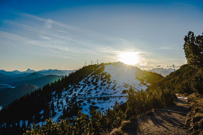 Scenic view of mountains against sky during sunset