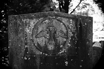 Close-up of cross in cemetery