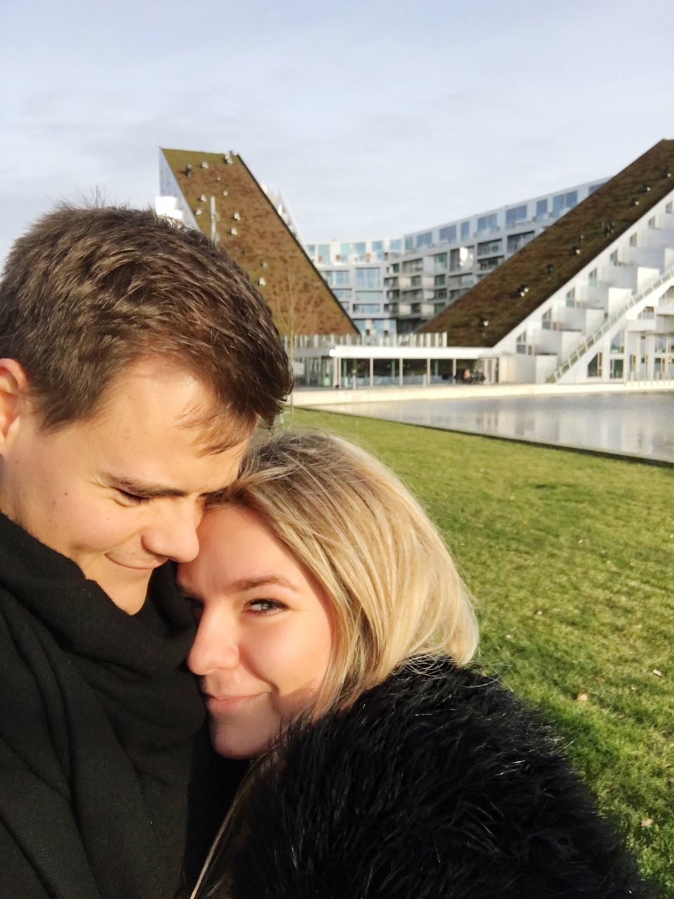 two people, love, togetherness, women, happiness, headshot, bonding, city, architecture, embracing, outdoors, smiling, blond hair, young women, leisure activity, building exterior, built structure, sky, cheerful, real people, day, portrait, men, adult, young adult, couple, people, cityscape, adults only