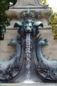 Close-up of statue against fountain